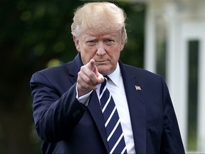 U.S. President Donald Trump walks out of the White House before departing July 19, 2019 in Washington, DC. Trump is traveling to New Jersey to host a fundraising dinner and spend the weekend at his Trump National Golf Club in Bedminster.