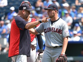 Cleveland Indians manager Terry Francona, left, gestures as starting pitcher Trevor Bauer leaves a game in the fifth inning against the Kansas City Royals at Kauffman Stadium on July 28, 2019 in Kansas City, Miss. (Ed Zurga/Getty Images)