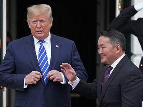 U.S. President Donald Trump welcomes Mongolian President Battulga Khaltmaa to the White House July 31, 2019 in Washington, DC. Khaltmaa, who traveled to the White House to seek trade and military deals with the United States, also symbolically gifted a horse to Trump's son, Barron. Trump said the horse will be named "Victory."