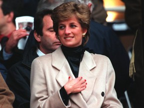Princess Diana watches the Welsh rugby union team during their first Five Nations match of the season against France at Parc des Princes in Paris, Jan. 21, 1995. (Pascal Rondeau/ALLSPORT)