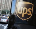 A United Parcel Service logo is displayed on a delivery truck on October 24, 2014 in San Francisco, California. United Parcel Service reported quarterly earnings that beat analyst estimates with revenue of $14.29 billion compared to $13.52 billion one year ago.