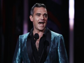 Robbie Williams presents on stage during the 30th Annual ARIA Awards 2016 at The Star on November 23, 2016 in Sydney, Australia. Cameron Spencer/Getty Images