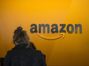 A visitor checks in at the Amazon corporate headquarters on June 16, 2017 in Seattle, Washington. (David Ryder/Getty Images)