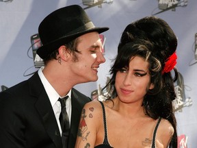 Musician Amy Winehouse (R) and husband musician Blake Fielder-Civil (L) arrive to the 2007 MTV Movie Awards held at the Gibson Amphitheatre on June 3, 2007 in Universal City, California. Vince Bucci/Getty Images for MTV
