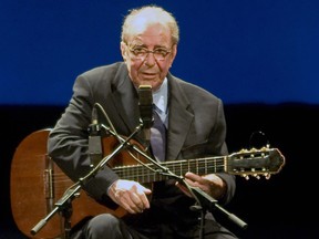 Brazilian musician Joao Gilberto, 77, acknowledges the audience during his presentation late at night on August 24, 2008 at the Teatro Municipal in Rio de Janeiro. (ARI VERSIANI/AFP/Getty Images)