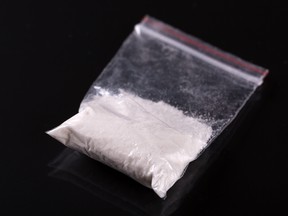 Cocaine in plastic packet on black background, closeup. (Getty Images)