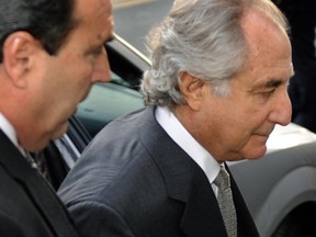 Disgraced Wall Street financier Bernard Madoff (C) arrives at a US Federal Court on March 12, 2009 in New York.