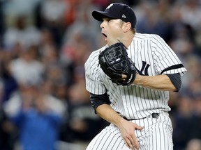 David Robertson of the New York Yankees reacts after hitting catcher Gary Sanchez with a wild pitch against the Minnesota Twins during the sixth inning in the American League Wild Card Game at Yankee Stadium on Oct. 3, 2017 in the Bronx borough of New York City.  (Elsa/Getty Images)