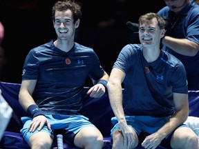 Andy Murray, left, and brother Jamie share a joke during their doubles match against Tim Henman and Mansour Bahrami during Andy Murray Live at The Hydro on November 7, 2017 in Glasgow, Scotland.  (Steve Welsh/Getty Images for Andy Murray Live)
