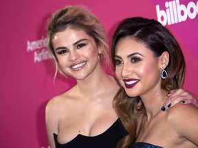 Singer Selena Gomez and actress Francia Raisa attend the Billboard Women In Music 2017 at the Ray Dolby Ballroom, on Nov. 30, 2017, in Hollywood. (VALERIE MACON/AFP/Getty Images)
