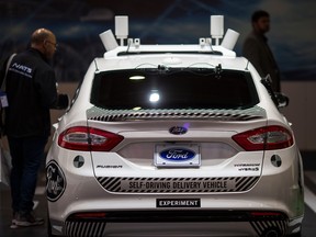 An experimental Ford Fusion self-driving delivery car is displayed at CES in Las Vegas, Nevada, January 12, 2018.
