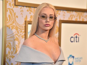 Iggy Azalea's online ring flaunting sparks rumours that the singer is secretly engaged to rapper Playboi Carti. Theo Wargo/Getty Images for Roc Nation