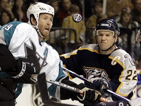 San Jose Sharks centre Joe Thornton (19) and Nashville Predators captain Greg Johnson (22) fight for the puck in Nashville, Tenn., Sunday, April 30, 2006. (AP Photo/Mark Humphrey)