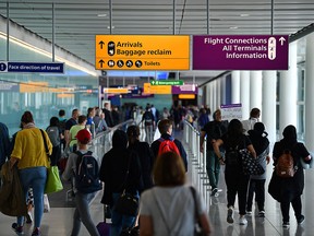 Passengers make their way through Terminal 2 having arrived at Heathrow Airport in London on July 16, 2019 (DANIEL LEAL-OLIVAS/AFP/Getty Images)