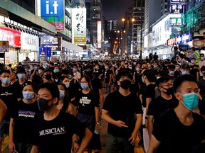 Anti-extradition bill protesters march at Hong Kong's tourism district Nathan Road near Mongkok, China July 7, 2019. (REUTERS/Tyrone Siu)