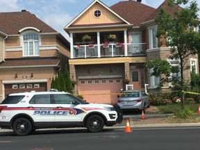 York Regional Police at a home on Castlemore Ave. in Markham on Monday, July 29, 2019, the day after four people were found murdered.