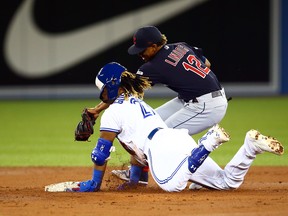 Jays' Vladimir Guerrero Jr. is tagged out by Cleveland's Francisco Lindor last night at Rogers Centre. (Getty Images)