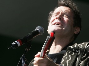Johnny Clegg of The Johnny Clegg Band performs on the main stage at Sunday's Folk Fest (Edmonton folk Music festival) at Gallagher Park in Edmonton.