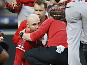 Angels catcher Jonathan Lucroy is tended to by medical staff after he was involved in a collision with Astros baserunner Jake Marisnick who was trying to score in the eighth inning at Minute Maid Park in Houston on Sunday, July 7, 2019.