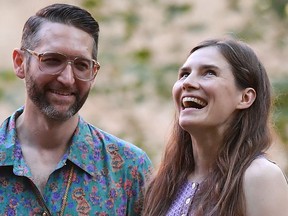 Amanda Knox (R) and her boyfriend, author Chris Robinson attend a cocktail event on the eve of the opening of the Criminal Justice Festival, at the Law University of Modena, northern Italy on June 13, 2019.