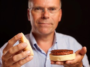 In this handout picture received via Ogilvy PR, Maastricht University professor Mark Post holds the world's first lab-grown beef burger in London on August 5, 2013. (HO/AFP/Getty Images)