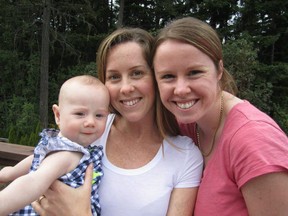 Kaydance Etchells, when she was nine months old, with her mothers Lauren Etchells, right , and Tasha Brown (left) , in June 2015.