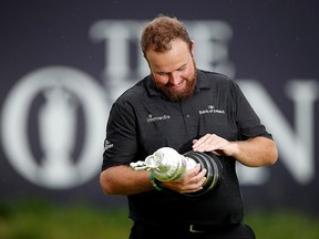 Shane Lowry celebrates with the Claret Jug trophy after winning the Open Championship Sunday at Royal Portrush. (REUTERS/Paul Childs)