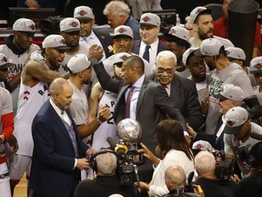 Kawhi Leonard (left) and team president Masai Ujiri shake hands after winning the East final. (Jack Boland/Toronto Sun)