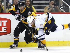 Matt Cullen, left, seen here in NHL playoff action with the Penguins battling for the puck with Ryan Ellis of the Predators on May 29, 2017, announced his retirement after 21 seasons on Wednesday, July 10, 2019.