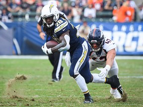 Running back Melvin Gordon of the Los Angeles Chargers runs in front of inside linebacker Joey Jewell of the Denver Broncos at StubHub Center on November 18, 2018 in Carson, California. (Jayne Kamin-Oncea/Getty Images)