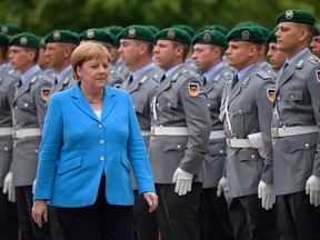 German Chancellor Angela Merkel greets an honour guard before the arrival of the Finnish Prime Minister at the Chancellery in Berlin on July 10, 2019. (TOBIAS SCHWARZ/AFP/Getty Images)