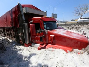 A truck is buried in ice after a heavy storm of rain and hail which affected some areas of Guadalajara, Mexico, on Sunday, June 30, 2019.