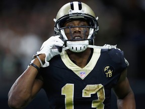 Michael Thomas of the New Orleans Saints pretends to make a call on a cell phone in celebration of scoring a touchdown against the Los Angeles Rams at Mercedes-Benz Superdome on November 4, 2018 in New Orleans. (Wesley Hitt/Getty Images)