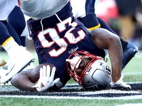 Sony Michelof the New England Patriots scores a touchdown during the second quarter in the AFC Divisional Playoff Game against the Los Angeles Chargers at Gillette Stadium on Jan. 13, 2019 in Foxborough, Mass.