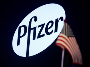 A logo for Pfizer is displayed on a monitor on the floor at the New York Stock Exchange (NYSE) in New York, U.S., July 29, 2019. REUTERS/Brendan McDermid/File Photo