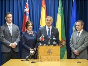 Alberta Attorney General Doug Schweitzer, left to right, New Brunswick Attorney General Andrea Anderson-Mason, Saskatchewan Attorney General Don Morgan and Ontario Attorney General Doug Downey during a media event regarding the meeting of the attorneys general to to discuss the appeal to the Supreme Court of Canada regarding the carbon tax at the Saskatoon Cabinet Office in Saskatoon, Sask. on Tuesday, July 30, 2019.