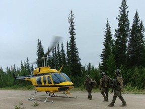 RCMP search the area near Gillam, Man., in this photo posted to their Twitter page on Friday, July 26, 2019.
