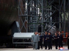 North Korean leader Kim Jong Un visits a submarine factory in an undisclosed location, North Korea, in this undated picture released by North Korea's Central News Agency (KCNA) on July 23, 2019.