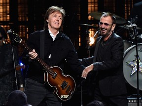 Sir Paul McCartney (L) and Ringo Starr perform onstage during the 30th Annual Rock And Roll Hall Of Fame Induction Ceremony at Public Hall on April 18, 2015 in Cleveland, Ohio.