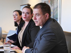 Lawyers Janelle O'Connor, Angela Bespflug and Patrick Higgerty (l-r) speak to media about the $100 million settlement awarded to women who suffered through harassment or discrimination while working or volunteering for the RCMP, in Vancouver, BC., July 8, 2019.