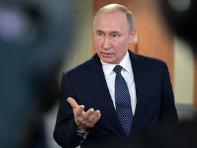 Russian President Vladimir Putin gestures as he gives a speech during the Global Manufacturing & Industrialisation Summit (GMIS) in Yekaterinburg on July 9, 2019. (ALEXEI DRUZHININ/AFP/Getty Images)