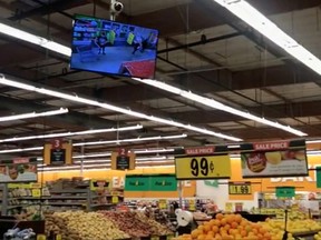 Signs sway during tremors felt at a supermarket in Hawthrone, Calif., during an earthquake that hit Southern California in this still frame taken from social media video dated July 5, 2019.