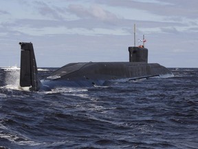 A file picture taken on July 2, 2009, shows new Russian nuclear submarine, the Yuri Dolgoruky, driving  in the water area of the Sevmash factory in the northern city of Arkhangelsk.