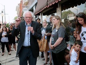 U.S. Sen. Bernie Sanders advocates for cheaper health care alongside type 1 diabetes patients, during a rally at a Canadian pharmacy after purchasing lower cost insulin in Windsor, Ont., July 28, 2019.
