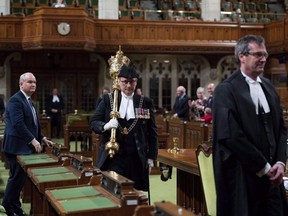 Deputy Sergeant-at-Arms Patrick McDonell carries the mace out of the House of Commons Chamber after the house rises, on Parliament Hill in Ottawa on Thursday, Dec. 13, 2018.