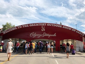 Visitors arrive at the Calgary Stampede entrance gate on the first day of the Stampede in Calgary, July 6, 2018. (REUTERS/Marcy Nicholson/File Photo)