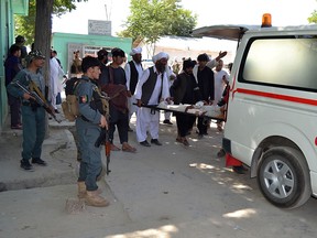 A wounded Afghan is brought to a hospital after a car bomb attack that targeted an intelligence unit in Ghazni on July 7, 2019. (STR/AFP/Getty Images)