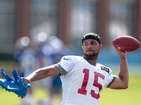 New York Giants wide receiver Golden Tate throws a ball to fans after the first day of training camp at Quest Diagnostics Training Center.
