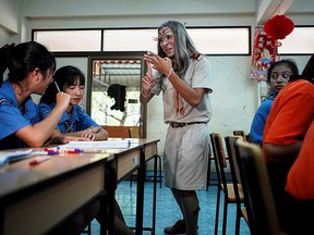 Teeraphong Meesat, 29, known as teacher Bally, teaches English in a classroom at the Prasartratprachakit School in Ratchaburi Province, Thailand, July 10, 2019.(REUTERS/Athit Perawongmetha)