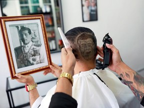 Mitree Chitinunda gets a haircut in the shape of Thai King Maha Vajiralongkorn, to mark King's 67th birthday, in a barbershop at Bangkok, Thailand July 28, 2019.